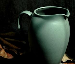 Featured is a photo of a beautiful form art pottery pitcher with green matte finish ... almost has a Teco look and feel! Photo (and vase ... even though it's reminiscent of early to mid-20th century art pottery) by Kay Pat from New Delhi, India.